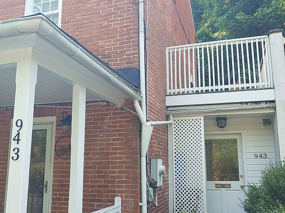 Exterior with view of upper level deck