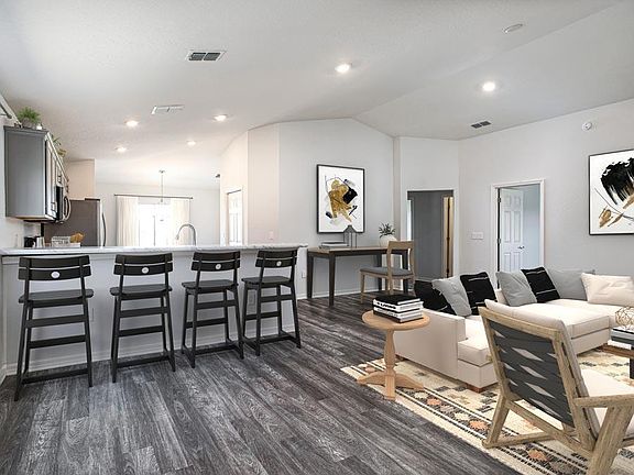 An open living area welcomes you home - Hibiscus home plan by Highland Homes
