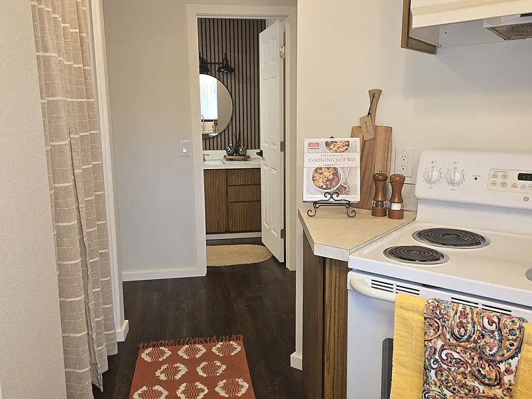View from kitchen towards bathroom, laundry on left. (laundry curtains, rug and staging items not included).