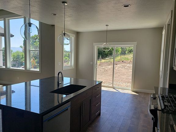 Kitchen overlooking backyard