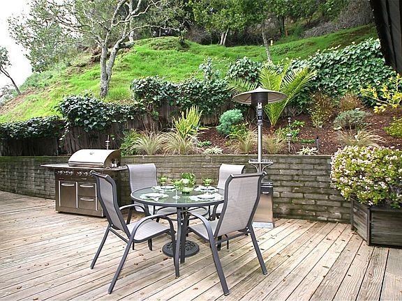 Back Patio protected from the wind. Enjoy winter & summer