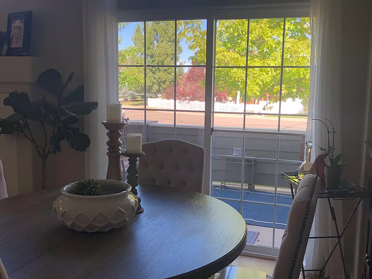 Dining area looking out sliding glass doors towards the patio.