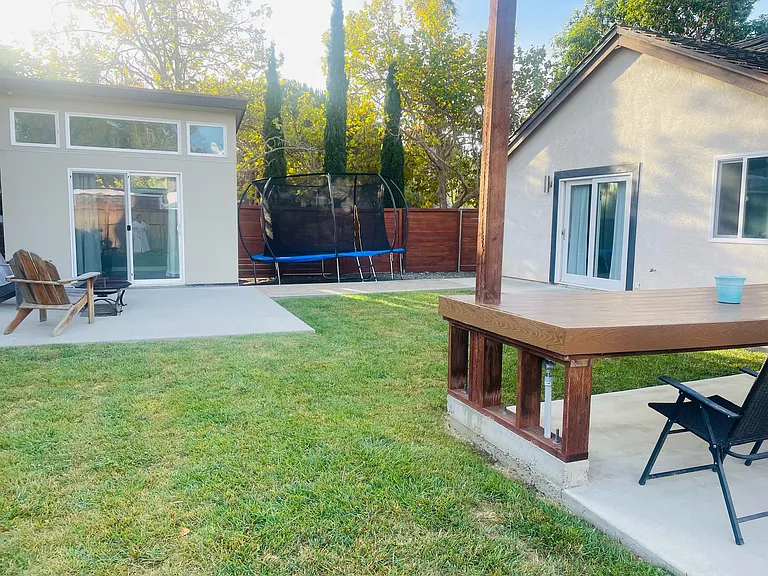 Backyard with view of office and primary bedroom