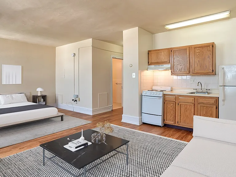 Spacious studio with wood flooring throughout