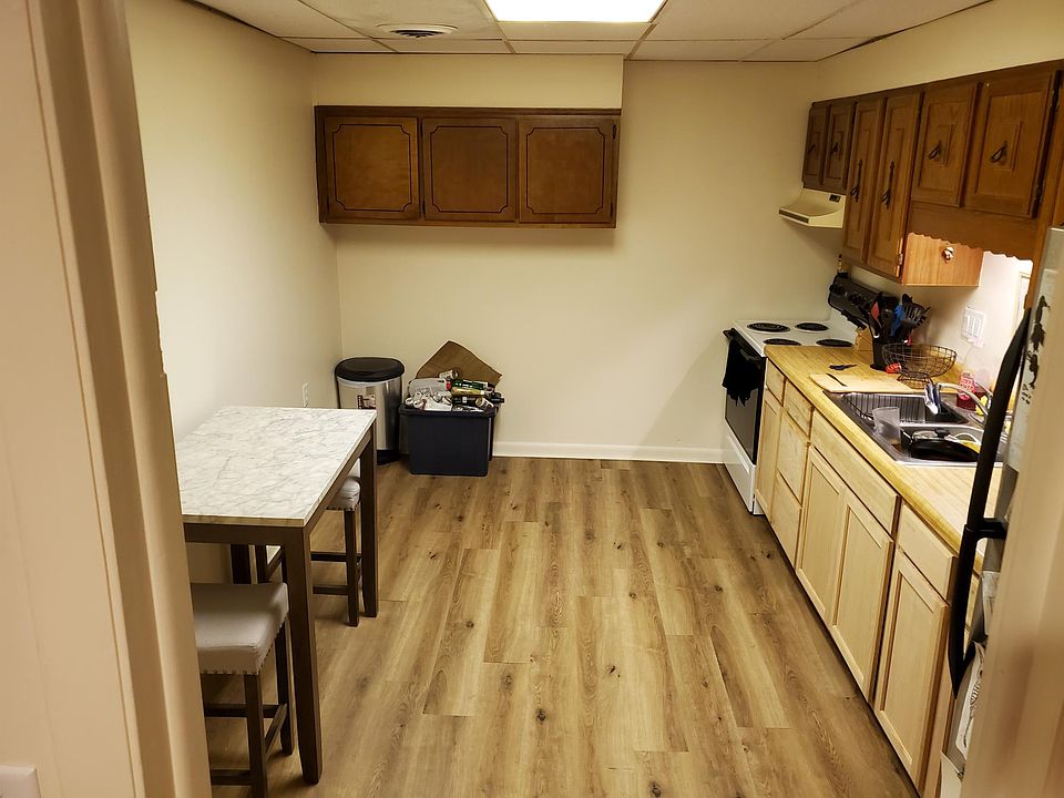 Kitchen with new floor, new lower cabinets, recent stainless steel refrigerator