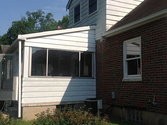 Back of house, with closed in porch