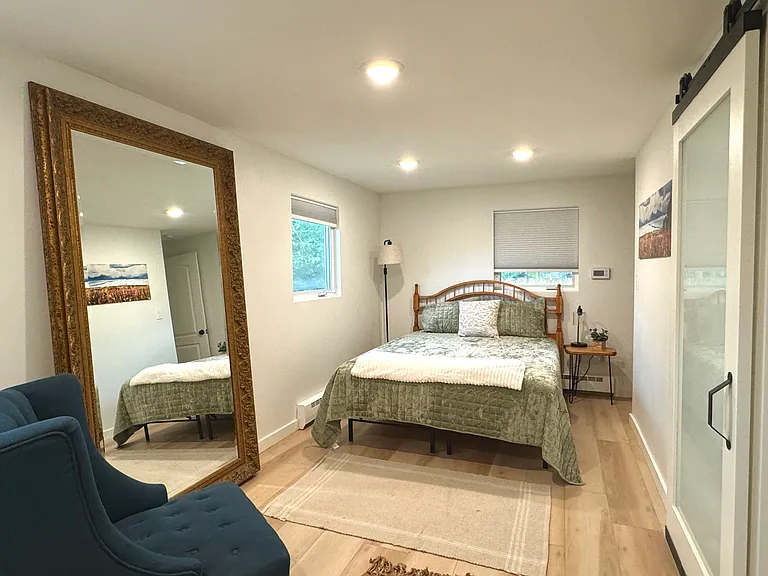 The downstairs bedroom with a Queen bed and blackout blinds