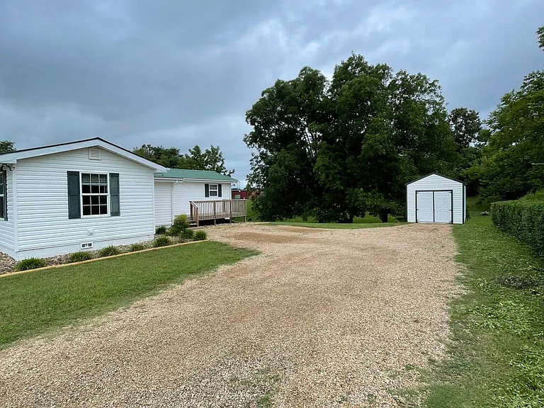 Private drive showing outbuilding