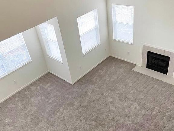 View from loft area of the living room. Vaulted ceilings and plenty of windows!