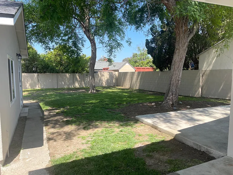 Large backyard with two patio areas. Great for pets and entertaining.

Detached garage with door access, lots of natural light and Air Conditioning.