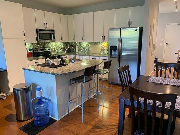 From the living area looking into the kitchen and dining area