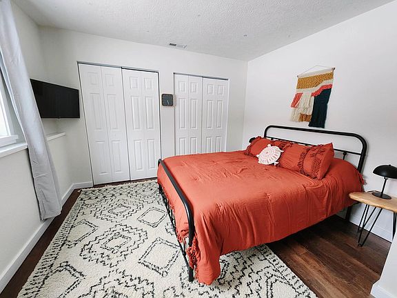 Queen bed in bedroom #3. TV in room and study area