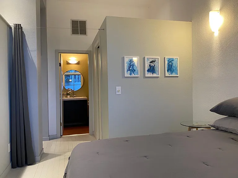From Bed area looking toward bathroom. Curtain closes for privacy