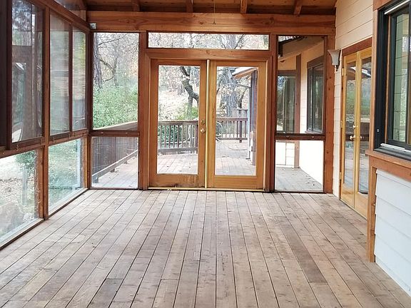 450 square feet screened in porch(has windows installed during the winter months) off kitchen. Leads to expansive decking overlooking the backyard.
