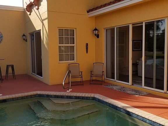 living room and master bedroom sliding patio doors for pool access