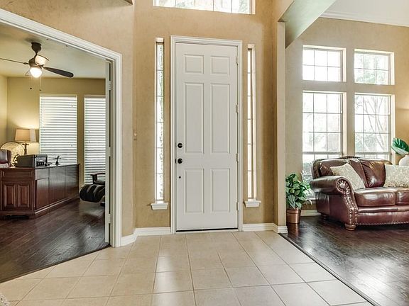 Large foyer has study with french doors on the right and formals on the left.