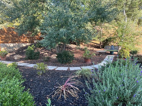 Path and seating area in front yard