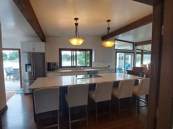 French doors leading out onto the top deck. Kitchen with full view of the lake