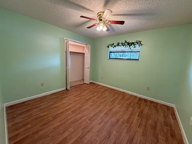 Spare bedroom with side street view.