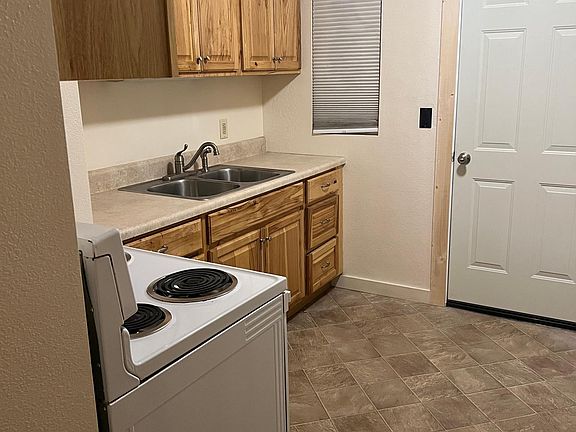 Kitchen with refrigerator and stove