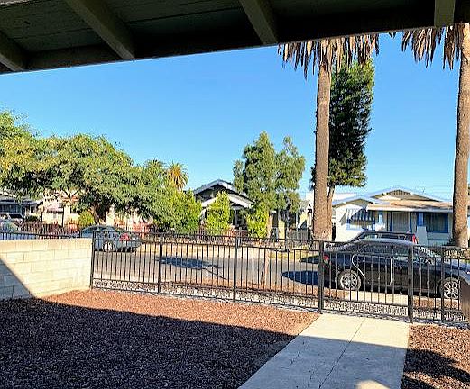 Front gated yard with low maintence mulch.