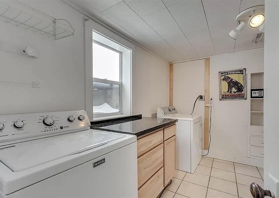 Laundry room with large closet and built-in storage. Additional storage room is not pictured.