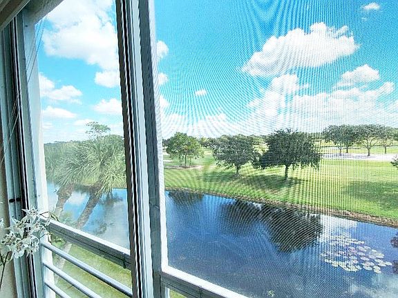 North view from our lanai. Sliding glass panels with solar shades enclose the lanai.
