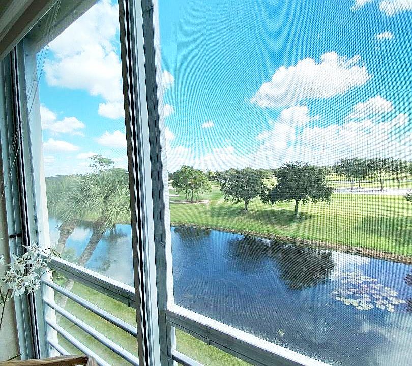 North view from our lanai. Sliding glass panels with solar shades enclose the lanai.