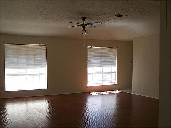 Living area with recently installed Bamboo Laminate flooring. New blinds coming soon!