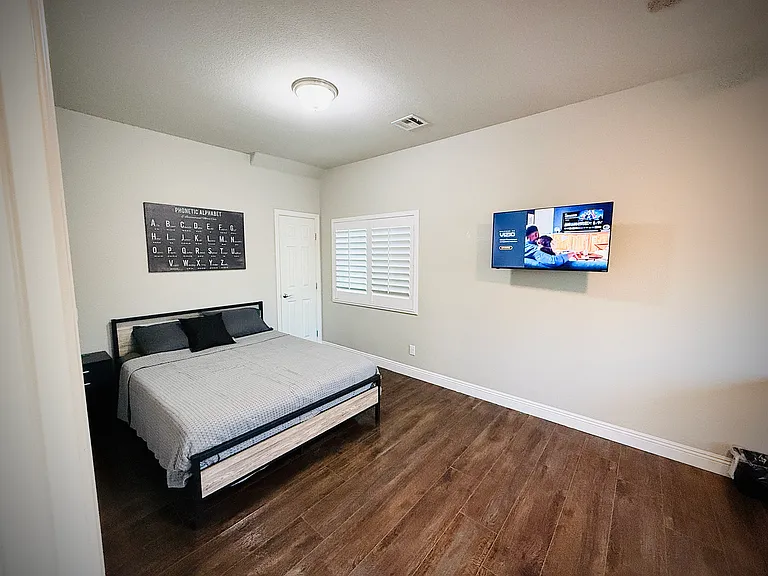 2nd floor Jr Suite. 20x10' bedroom with queen bed, new memory foam mattress, adjustable height desk, and TV
