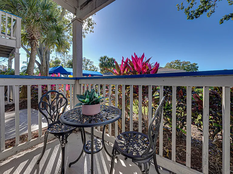 Relax on your private patio with outdoor seating and beautiful landscaped surroundings.