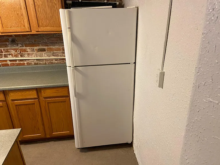 Kitchen looking right to left photo #1. Full size fridge with ice maker!