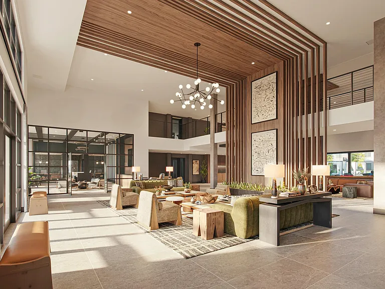 A light-filled lobby welcomes you home with wood detailing, layered seating, and expansive gathering spaces.