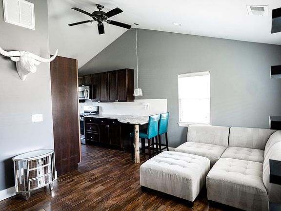 Furnished open-concept kitchen and living space.