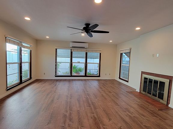picture of the living room showing 6 of the 7 large windows.