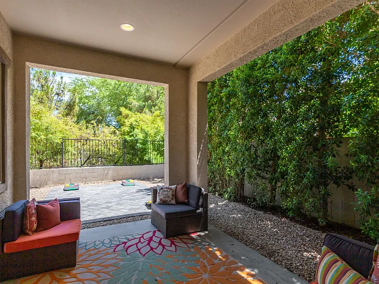 Additional beautiful 20-foot Hollywood hedge trees provide abundant greenery, added privacy, and cooling shade year-round.