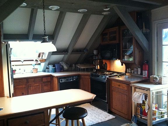 kitchen has corian counters and skylight