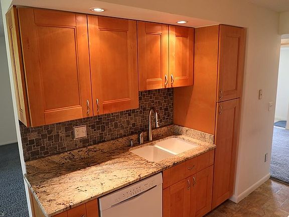 Built in pantry on the right of the kitchen sink.