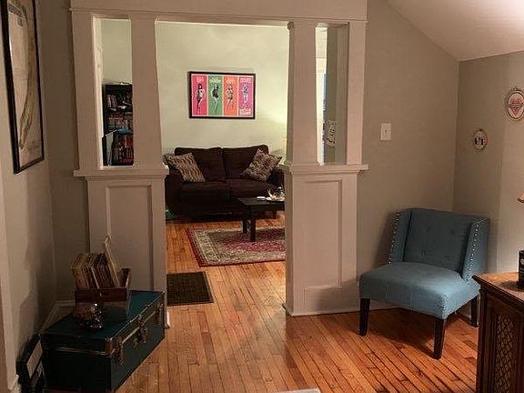 Foyer looking into Living Room w/ Original Details and Hardwood Floors.