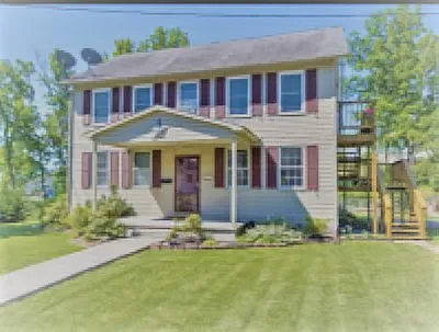 Steps to apartment are on the right side of the house