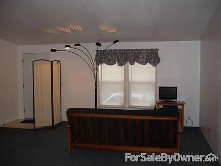 Living Room
						:
						Extra large living room
Vaulted ceilings throughout home