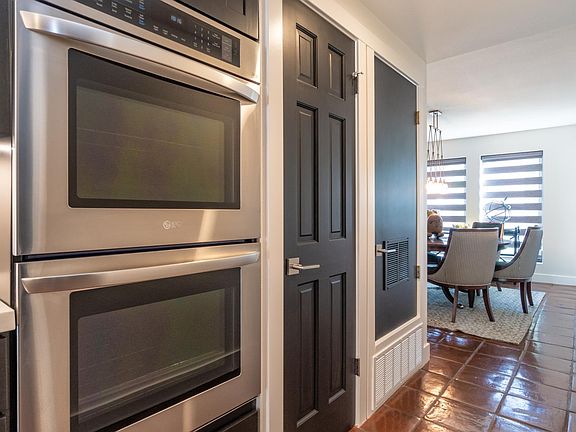 Utility closet behind this door with shelving.