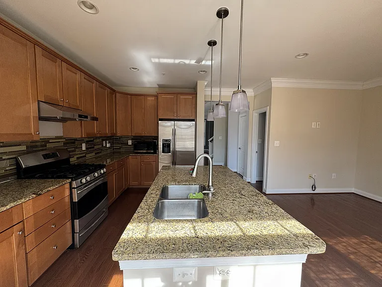 Kitchen with island and family room