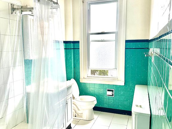 Bright spacious bathroom with full tub