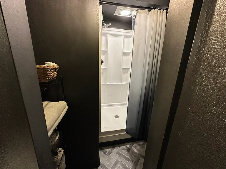Downstairs shower with rainfall water head.
