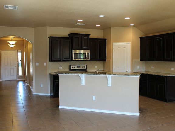 Entry on left and kitchen