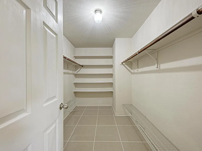 Primary closet with plenty of storage.