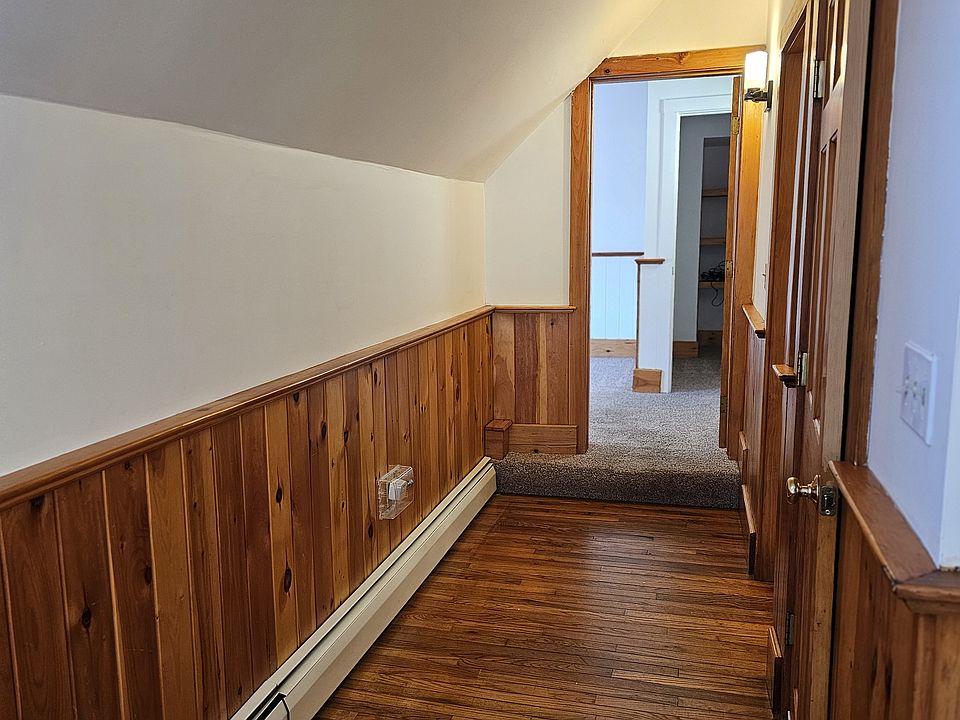 Hallway off of Kitchen leading to living room, bathroom and entrance to unit