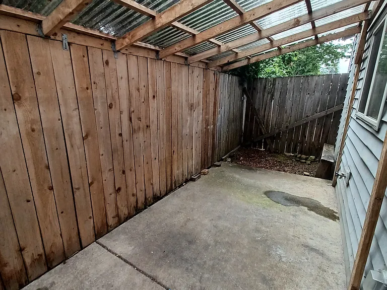 Covered fenced patio area
