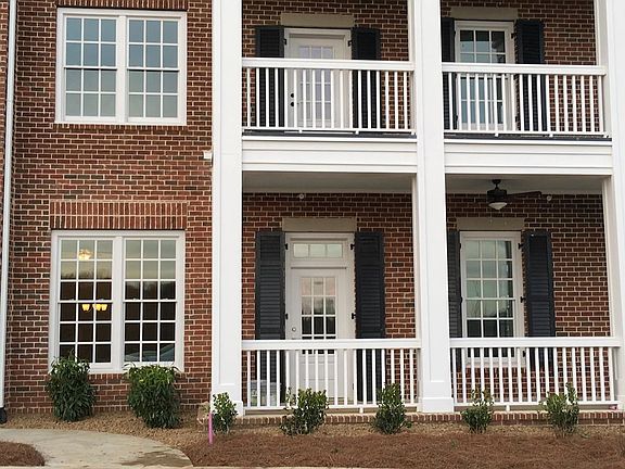 Welcome Home -- Wrap-around Front Porch with two Ceiling Fans.